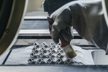 A DMLS/SLM metal 3D printer in action
